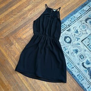 Black silk/chiffon mini dress with lace key hole detail